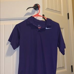 It is a YOUTH large purple nike Dri-fit polo